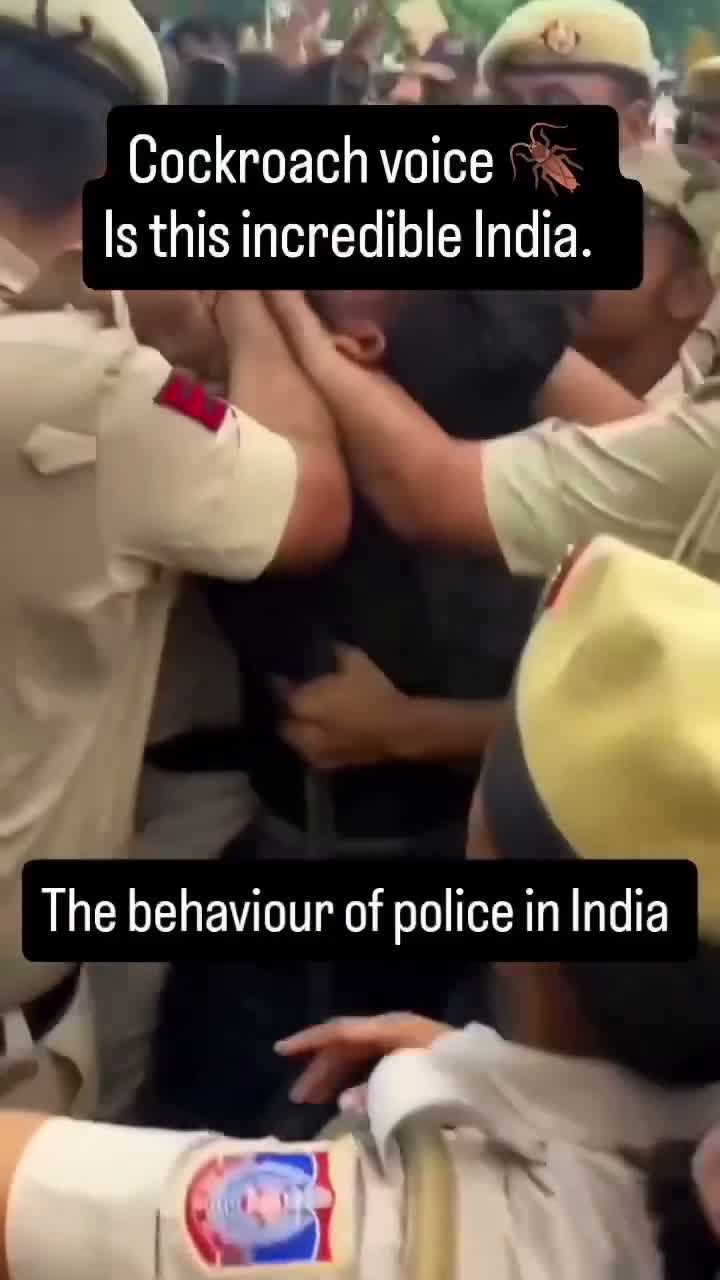 Scuffle among police officers, captioned as criticism of police conduct