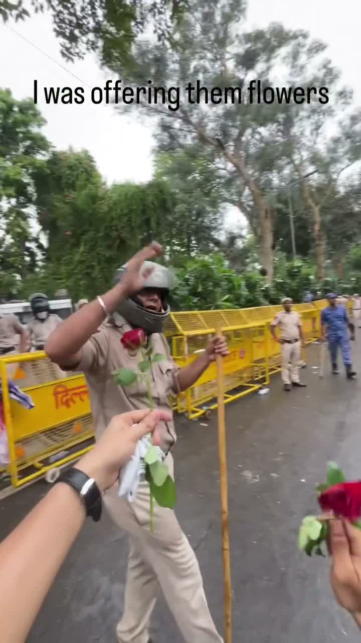 Riot police line a wet street; caption reflects on "what I got in return"