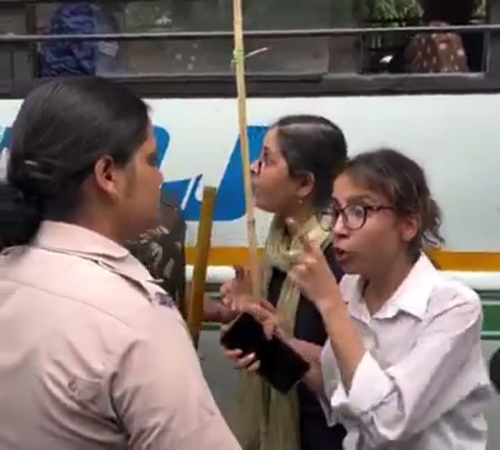 Reddit repost: woman covers interviewee's mouth near a press microphone